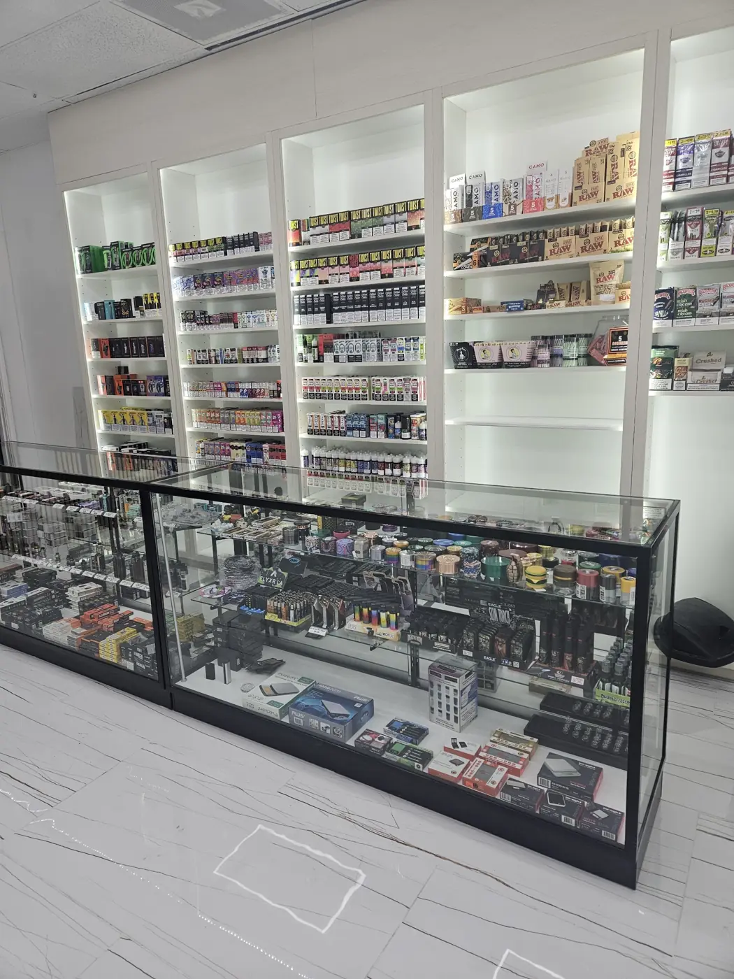 Front counter and vape wall at Huff N Puff Humble