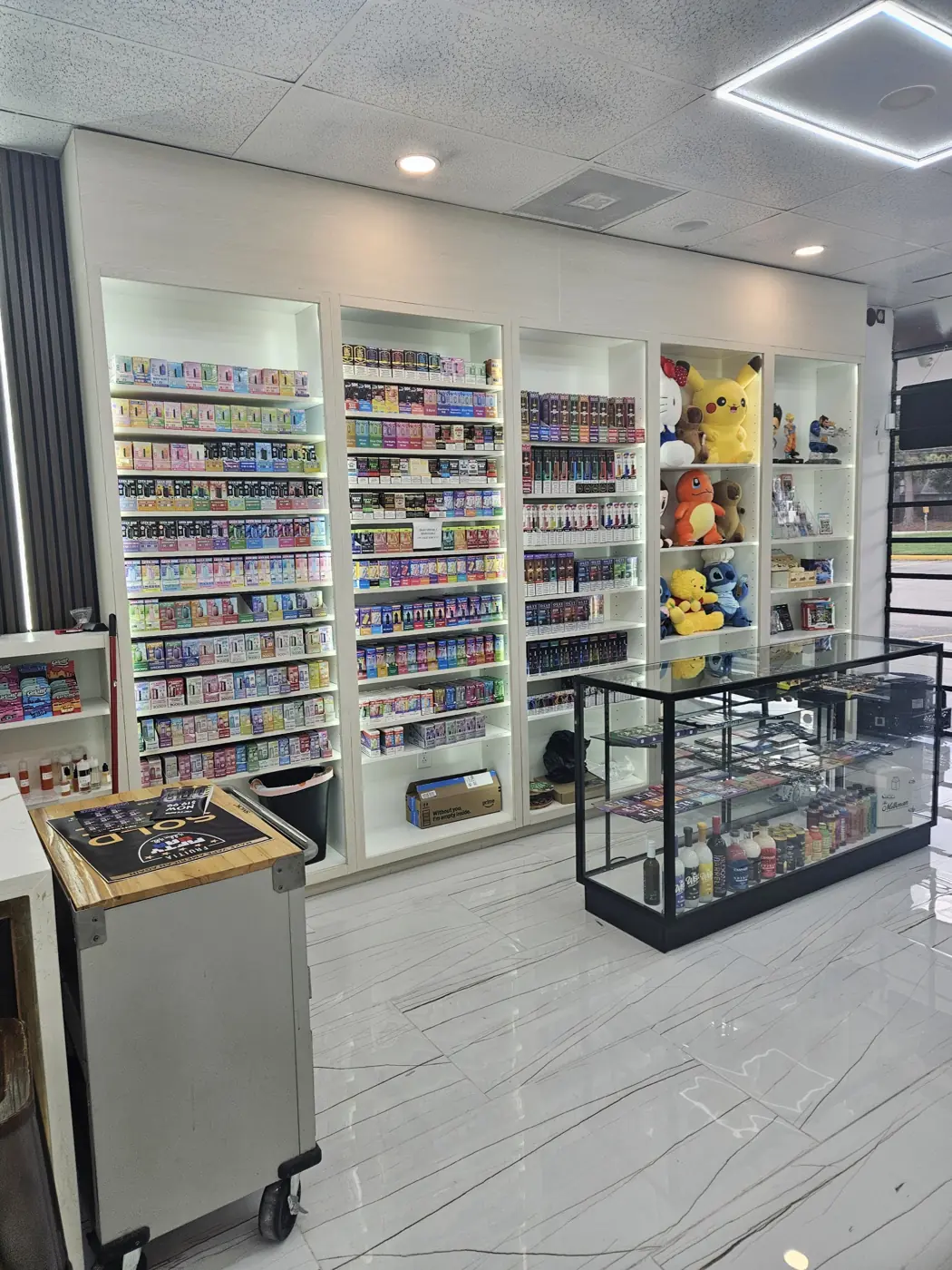 Vape shelves and glass cases inside Huff N Puff Humble on Atascocita Rd